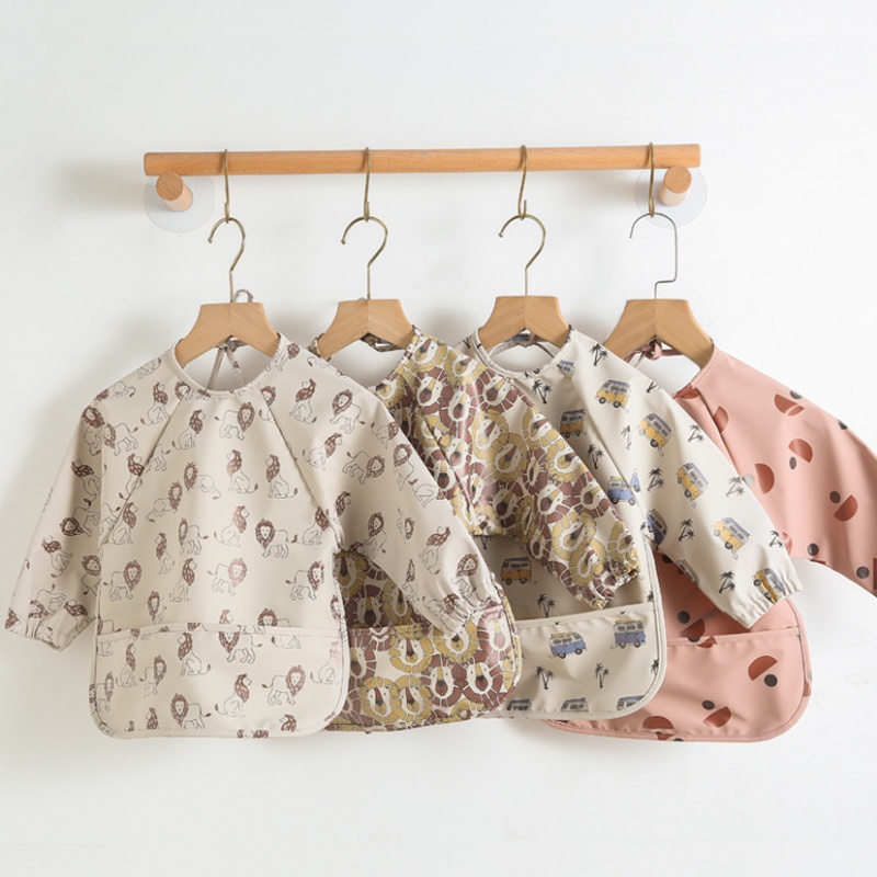 Long-sleeved PU reversible bib - Bib Long Sleeve recension och pris