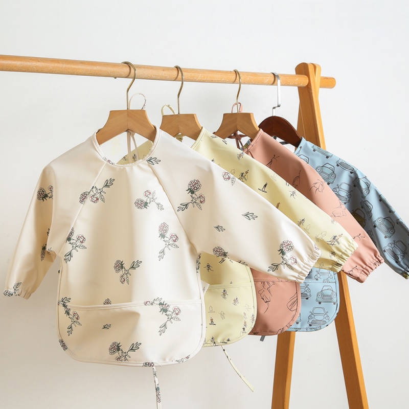 Long-sleeved PU reversible bib - Bib Long Sleeve recension och pris